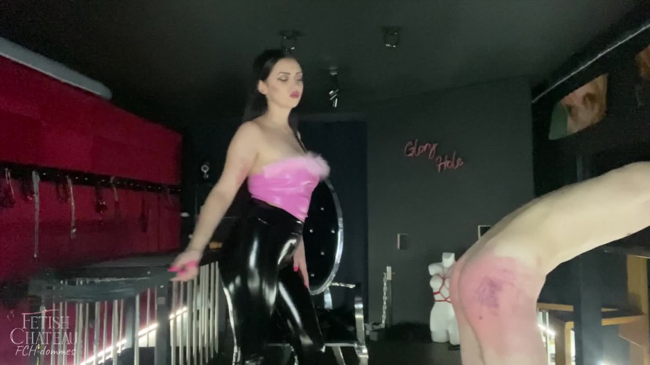 FCH Dommes - Mistress Glamorous is whipping her slave in stocks
